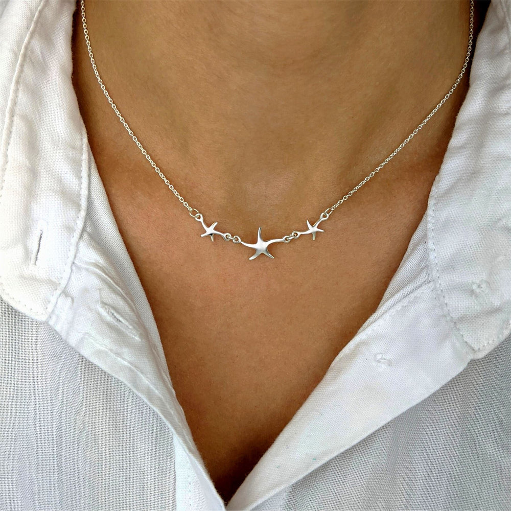 
                  
                    Sterling Silver Triple Starfish Pendant Charm Chain Necklace
                  
                