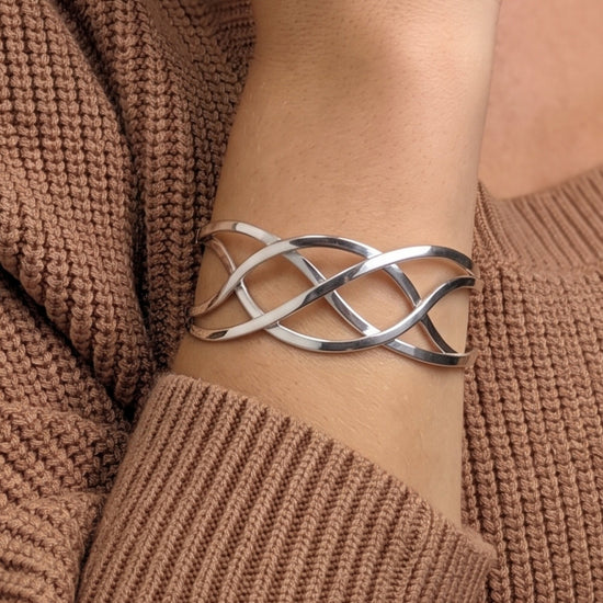 Sterling silver wide Celtic knot cuff bangle — braided crossover design