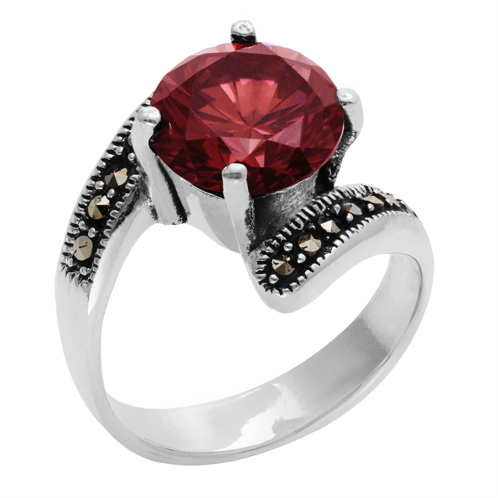 
                  
                    Sterling Silver Black Marcasite Red CZ Round Cut Bypass Ring
                  
                