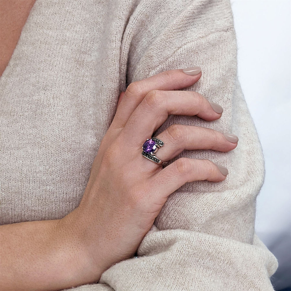 
                  
                    Sterling Silver Marcasite Purple CZ Round Cut Bypass Ring
                  
                