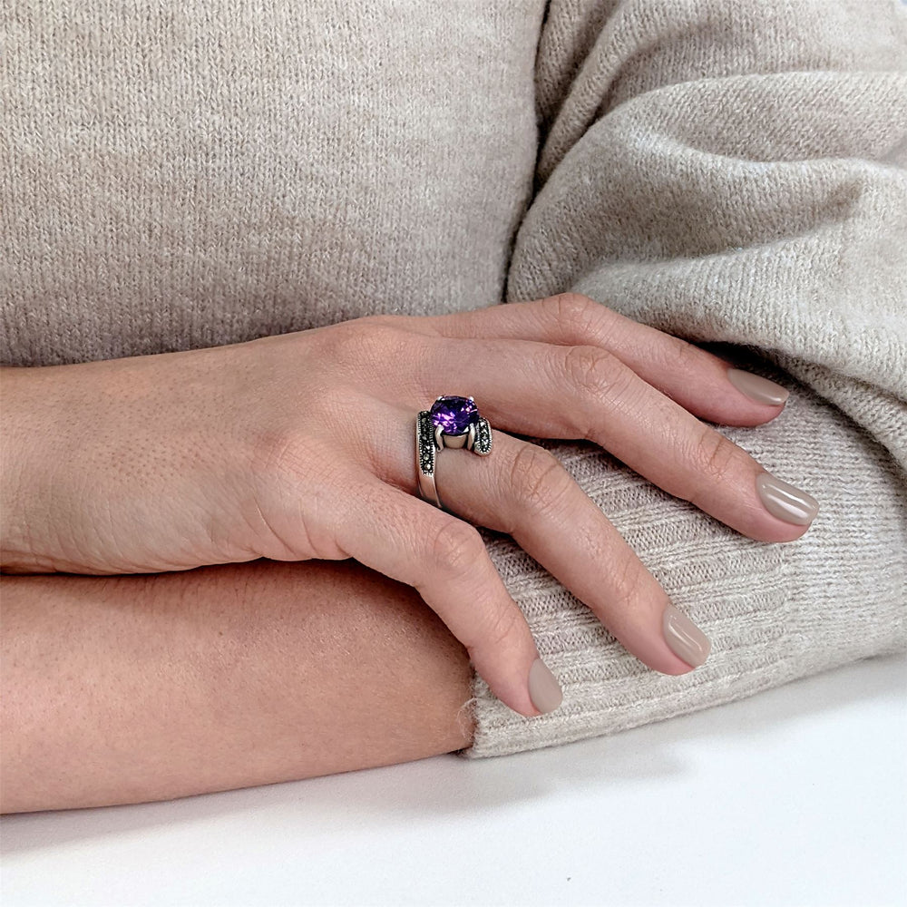 
                  
                    Sterling Silver Marcasite Purple CZ Round Cut Bypass Ring
                  
                