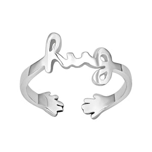 
                  
                    Sterling Silver Hug Word Script Ring - Hugging Hand Open Band
                  
                