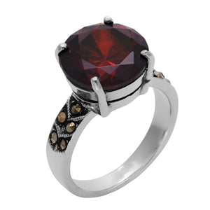 
                  
                    Sterling Silver Marcasite Solitaire Red Round CZ Ring
                  
                