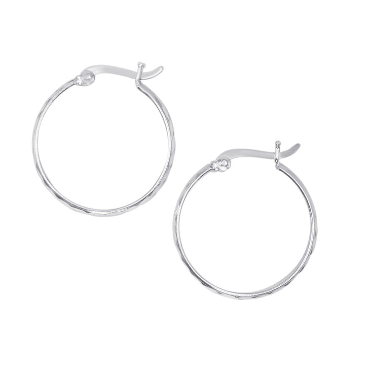 Close-up of sterling silver diamond cut hoop earrings