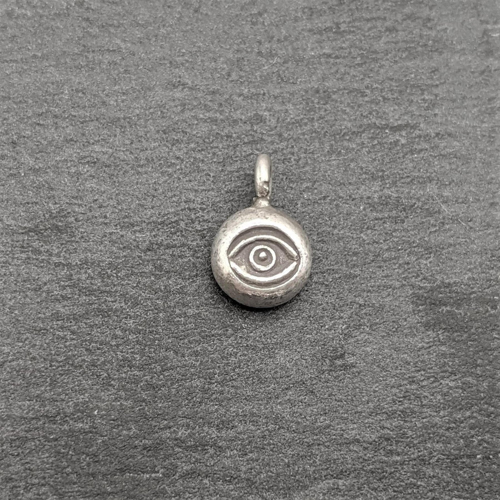 
                  
                    Pure Silver Karen Hill Tribe Small Round Eye Engraved Tribal Pendant
                  
                