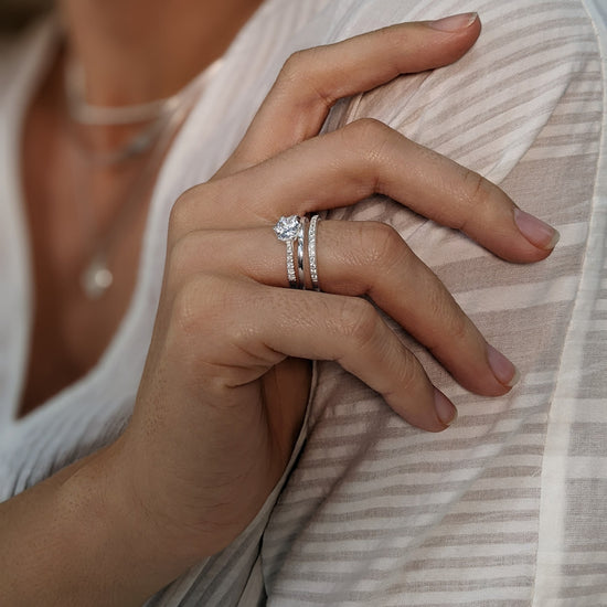 
                    
                      Sterling silver cubic zirconia double band ring styled with a solitaire engagement ring — minimalist stack
                    
                  