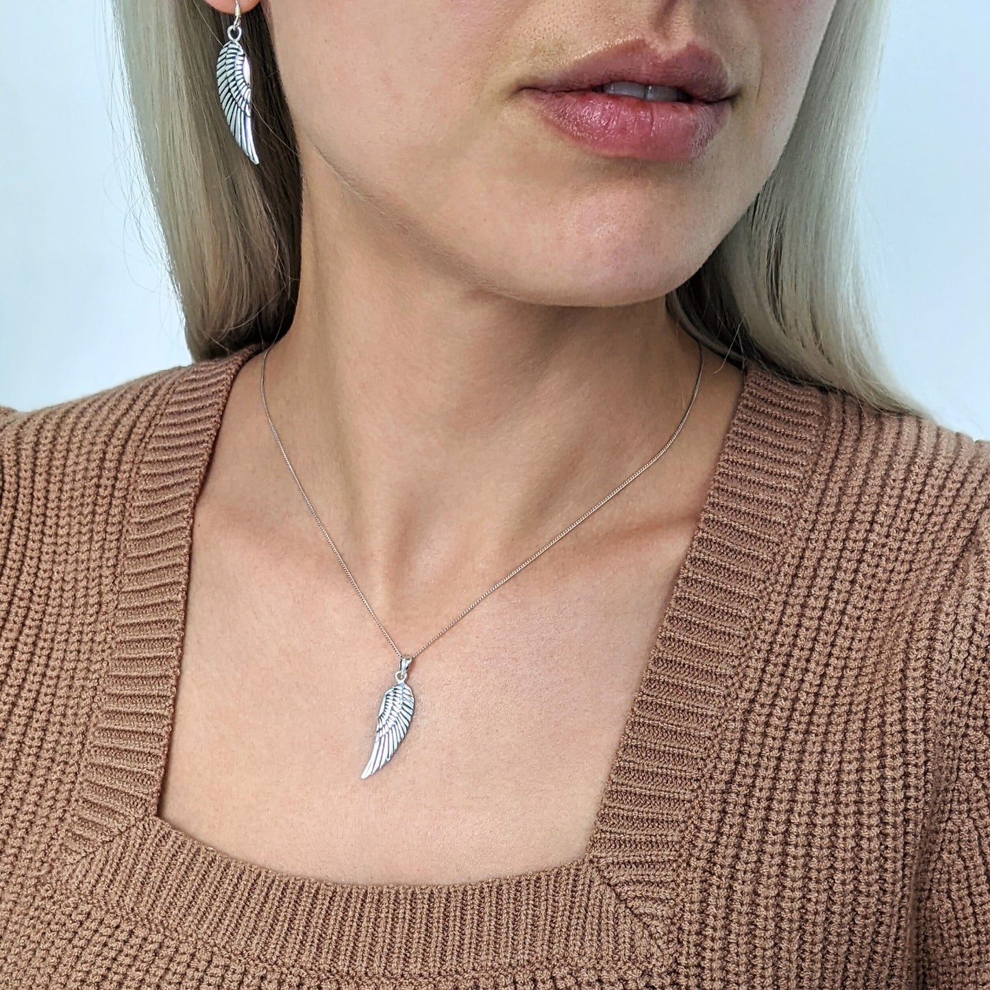 
                  
                    Sterling Silver Long Detailed Angel Wing Feather Pendant Necklace
                  
                