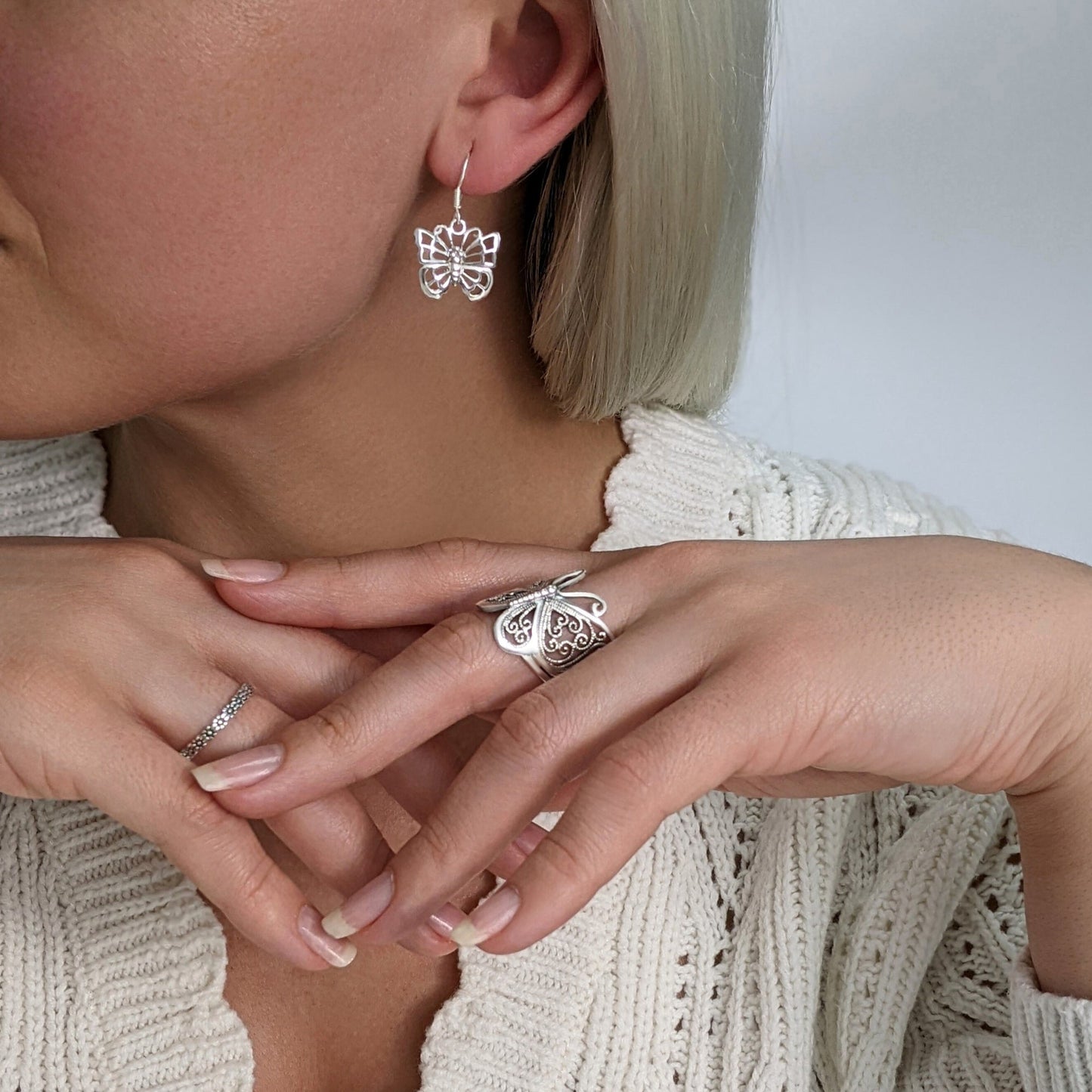 Sterling silver filigree butterfly ring styled with matching butterfly earrings — Y2K cute jewellery look