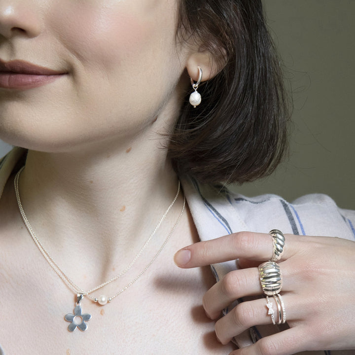 925 sterling silver CZ band ring styled with ripple-textured rings and pearl pendant necklace