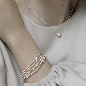
                  
                    Sterling Silver Ball Station Stretch Bracelet - Stacking Bead Design
                  
                