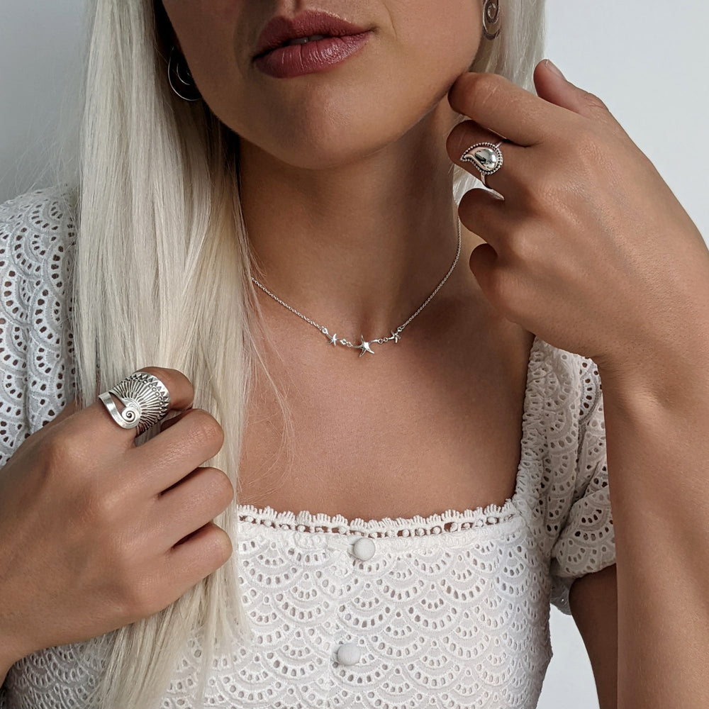 
                  
                    Sterling Silver Triple Starfish Charm Cable Chain Necklace
                  
                