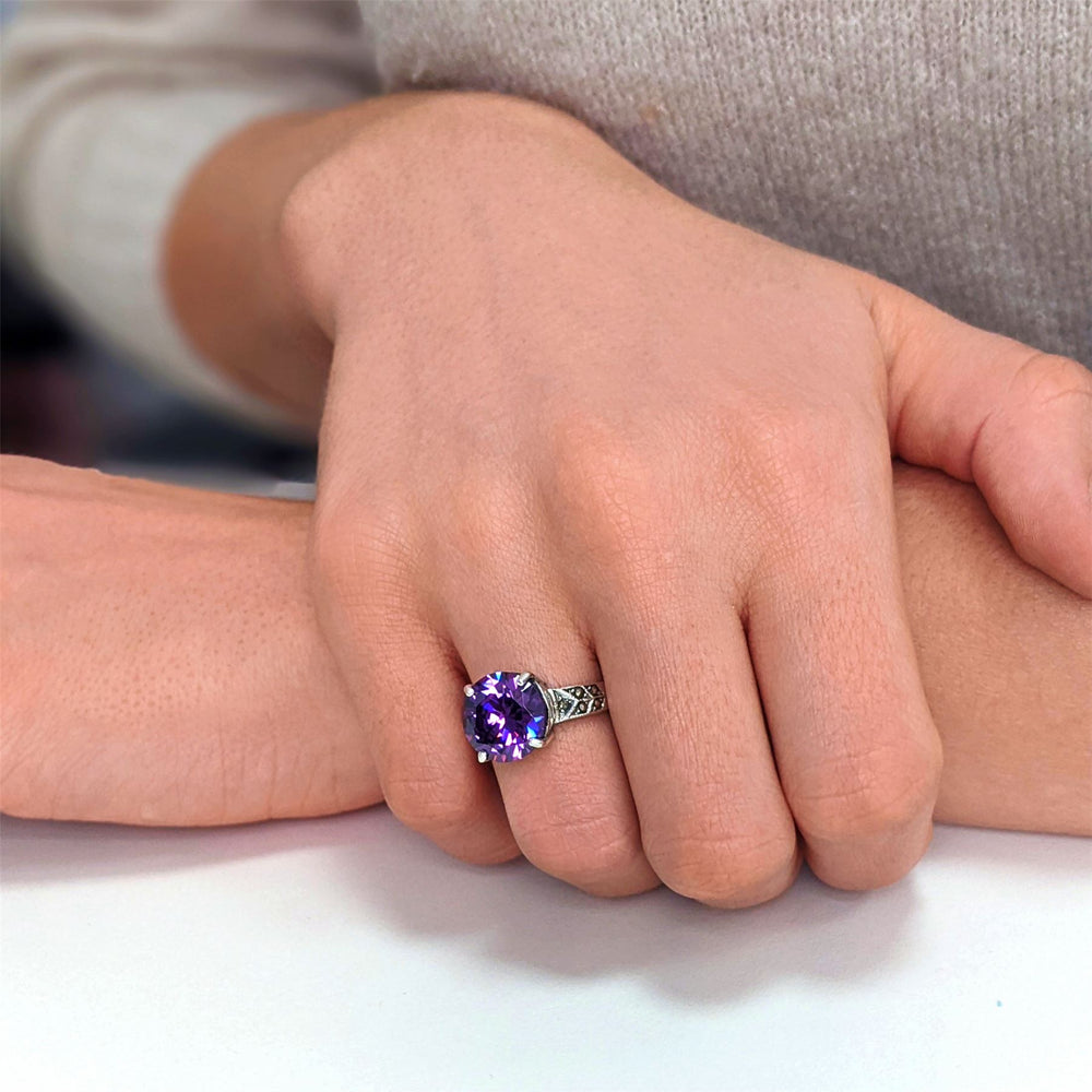 
                  
                    Sterling Silver Marcasite Solitaire Purple Round CZ Ring
                  
                