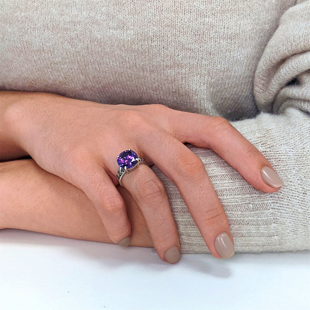 
                  
                    Sterling Silver Marcasite Solitaire Purple Round CZ Ring
                  
                