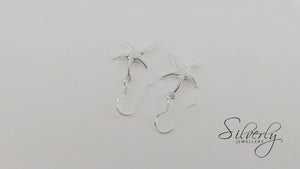 
                  
                    Load and play video in Gallery viewer, Sterling Silver Starfish Dangle Earrings With Hooks Beach Inspired
                  
                