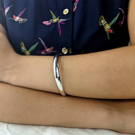 
                    
                      Sterling silver D-shape slip-on bangle
                    
                  