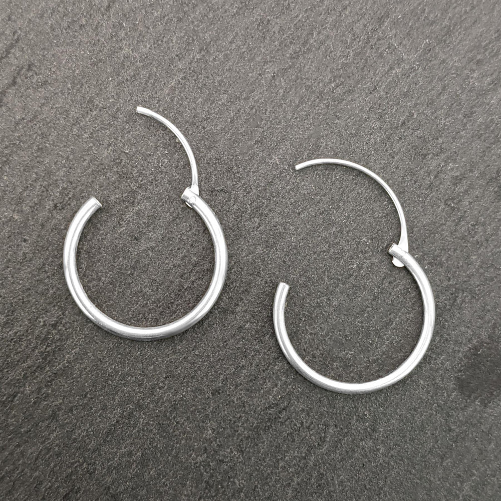 
                  
                    Sterling Silver Small 16 mm Thin Hoops Hinged Hoop Earrings
                  
                
