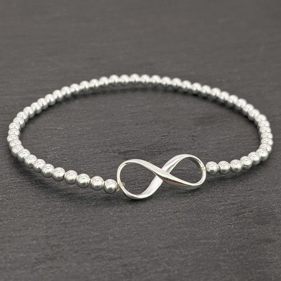 
                    
                      Sterling silver infinity charm bracelet
                    
                  