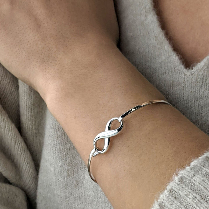 Sterling silver infinity bangle with hook clasp — thin stacking bracelet
