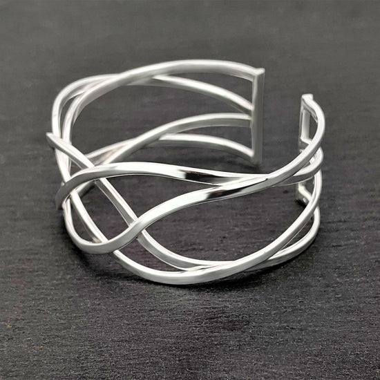 
                    
                      Sterling silver Celtic knot cuff bangle — wide statement bracelet
                    
                  