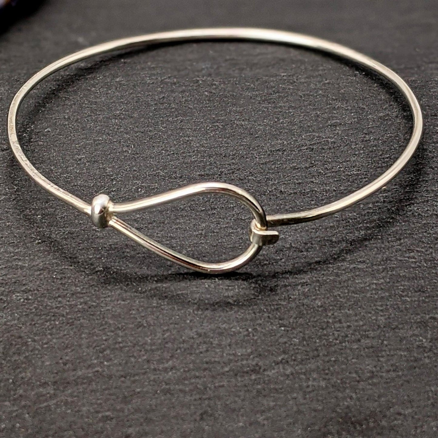 
                  
                    Sterling Silver Elegant Thin Hook Loop Fastening Bangle Bracelet
                  
                