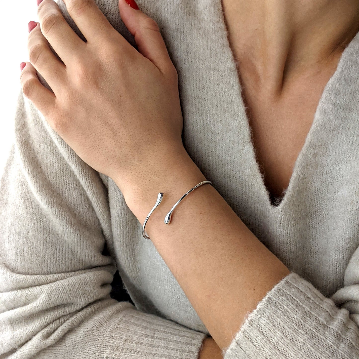 
                  
                    Sterling Silver Thin Wire Round Tube Teardrop Wrap Adjustable Bangle
                  
                