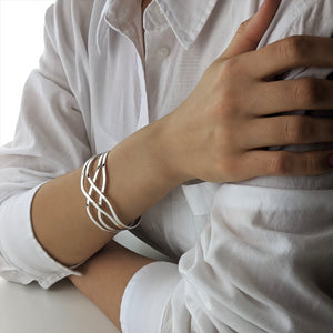 
                  
                    Sterling Silver Wide Crossover Celtic Knot Adjustable Cuff Bangle
                  
                