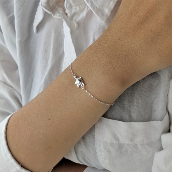 
                    
                      Sterling silver turtle charm bracelet
                    
                  