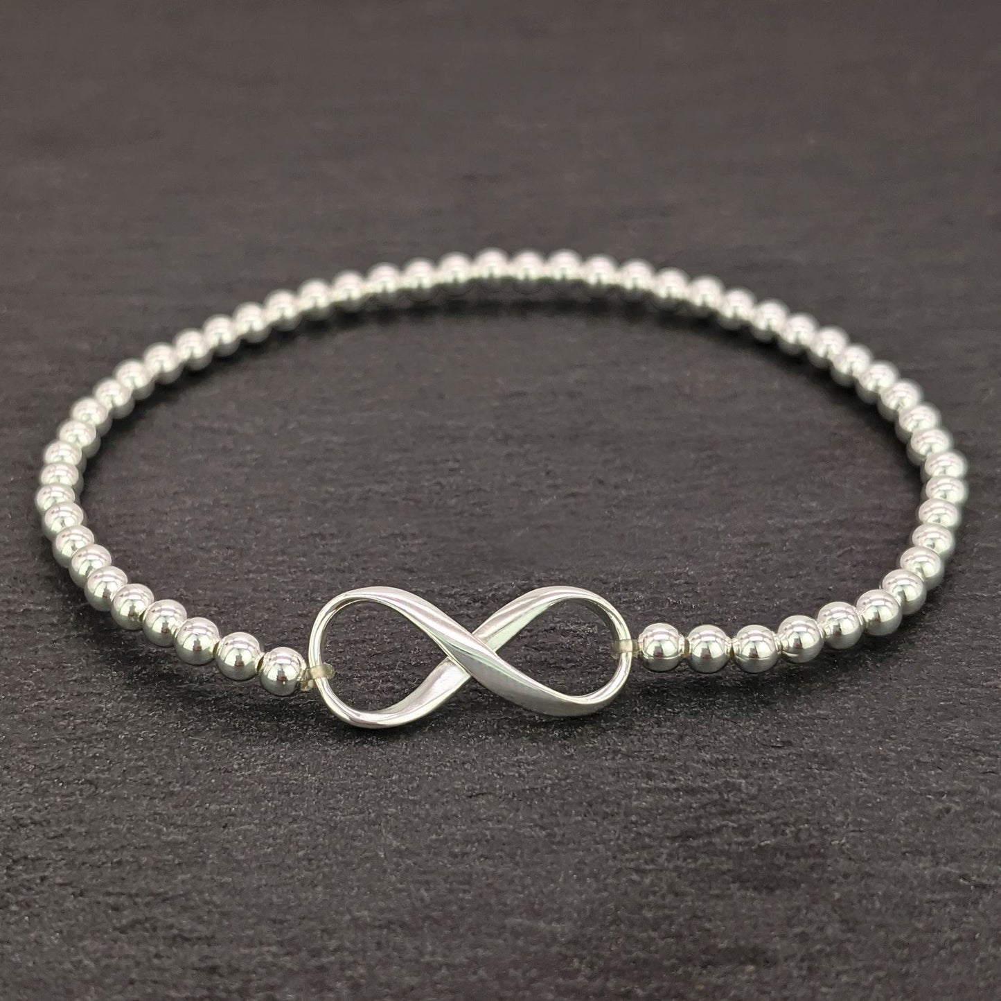
                  
                    Sterling Silver Infinity Knot Stretch Beaded Bracelet With Ball Beads
                  
                