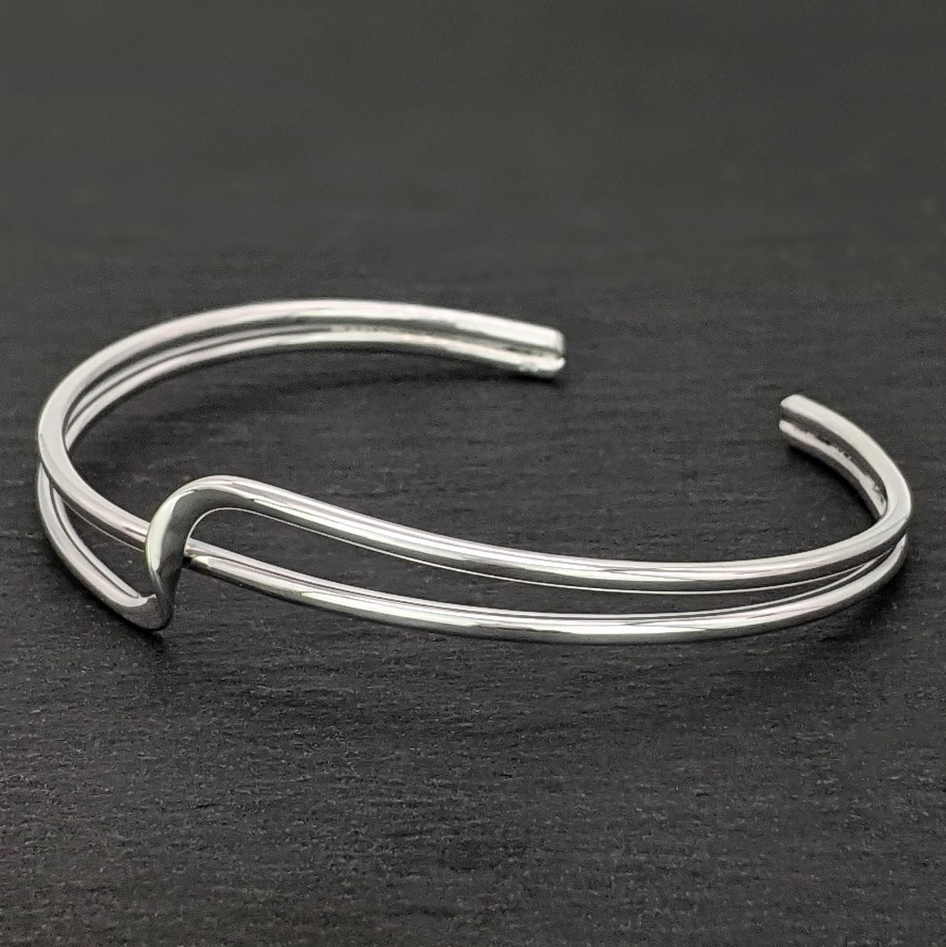 
                  
                    Sterling Silver Double Row Twist Band Wave Crossover Cuff Bangle
                  
                