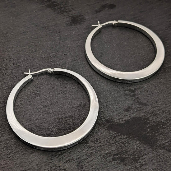 
                    
                      Sterling silver chunky statement hoop earrings with saddleback closure
                    
                  