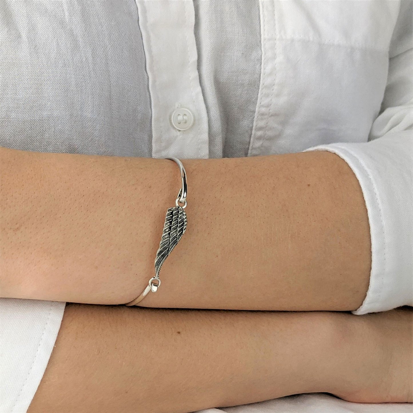 
                  
                    Sterling Silver Thin Elegant Angel Bird Wing Bangle With Hook Clasp
                  
                
