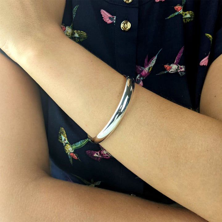 Close-up of sterling silver D-shape bangle