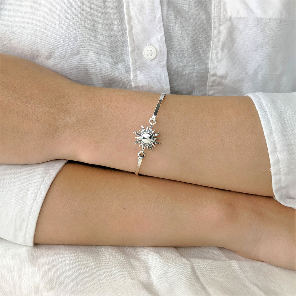 
                  
                    Sterling Silver Thin Elegant Blazing Sun Bangle With Hook Clasp
                  
                
