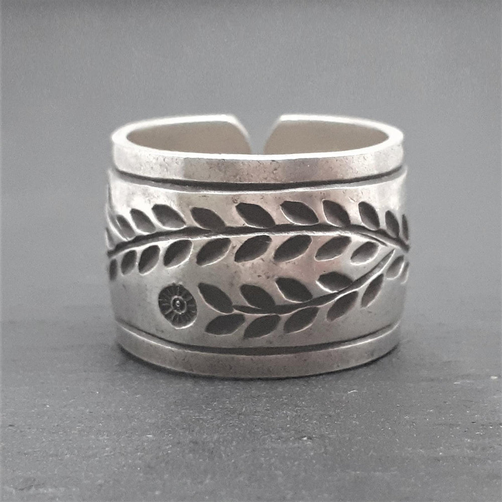 
                  
                    Hill Tribe Silver Wide Band Engraved Flower Leaf Adjustable Ring
                  
                