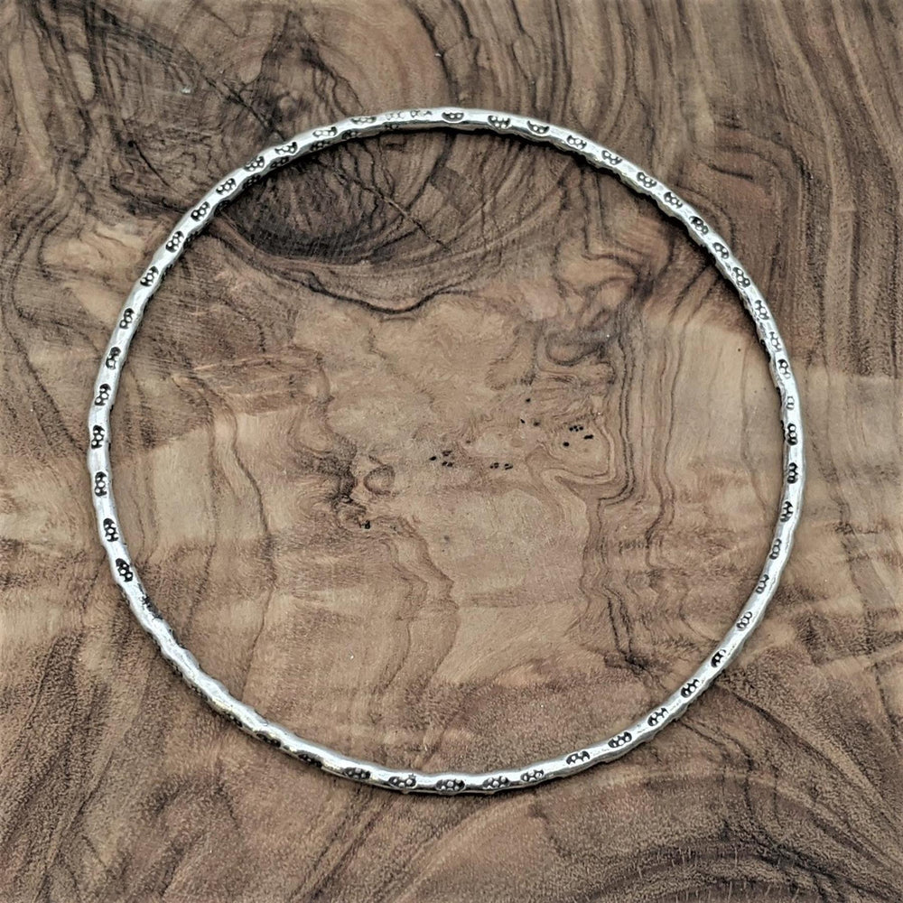 
                  
                    Hill Tribe Silver Thin Round Tube Tribal Motif Stackable Bangle
                  
                