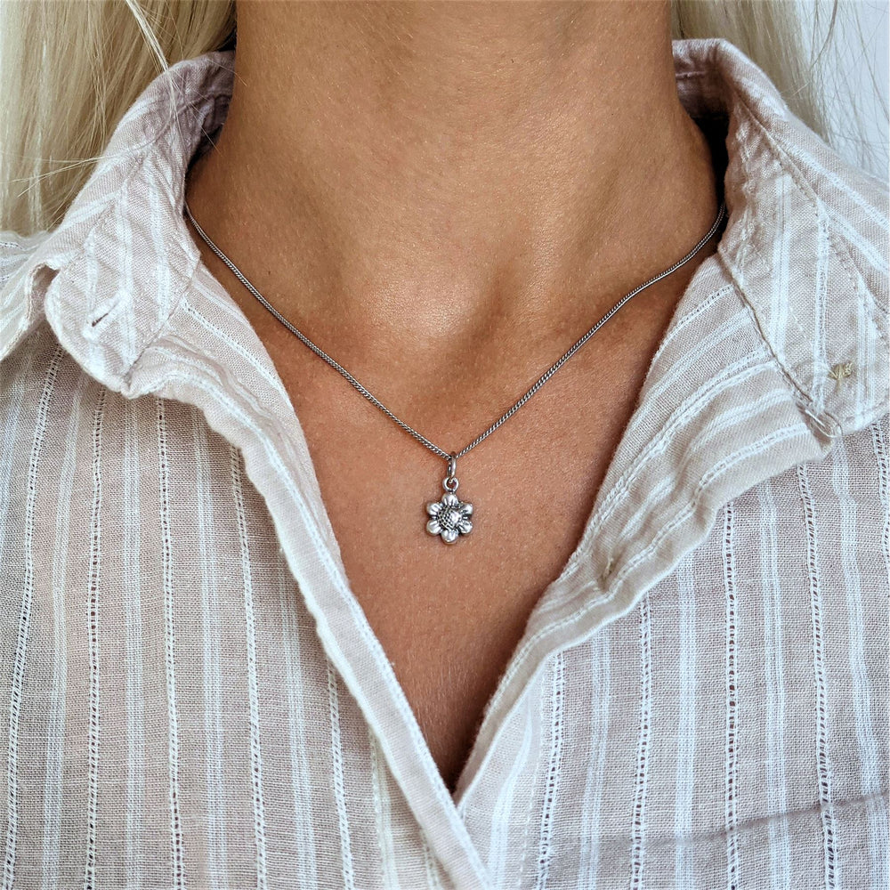 
                  
                    Sterling Silver Small Daisy Flower Pendant Necklace w/ Curb Chain
                  
                