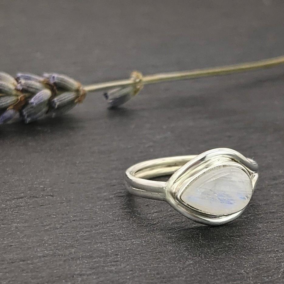 
                  
                    Sterling Silver Pear Shaped Moonstone Lasso Knot Band Birthstone Ring
                  
                