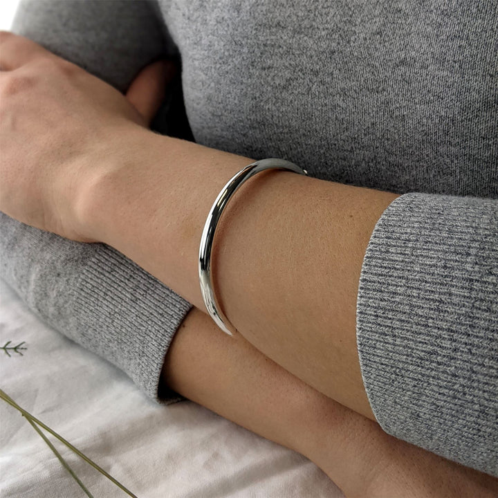 Sterling silver round hinged bangle worn on wrist — 6cm inner diameter stackable design