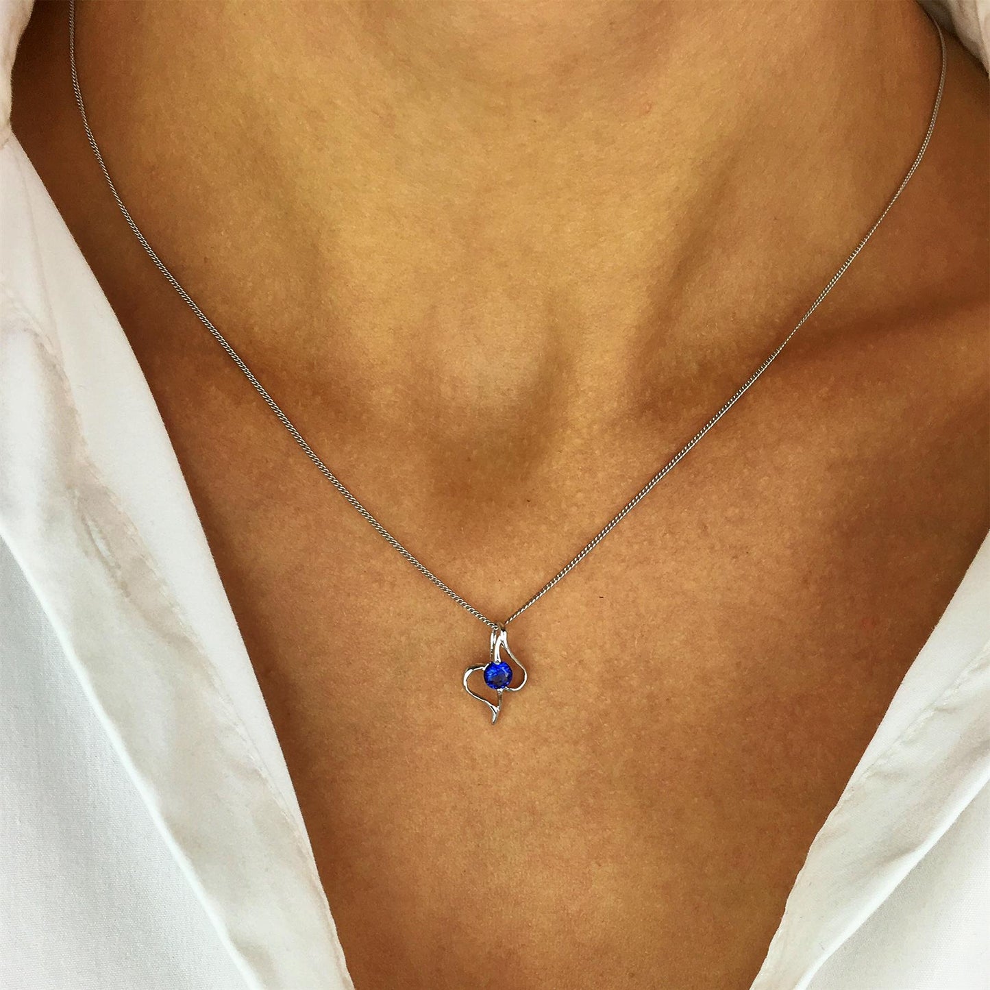
                  
                    Sterling Silver Blue Crystal Abstract Heart Teardrop Pendant Necklace
                  
                