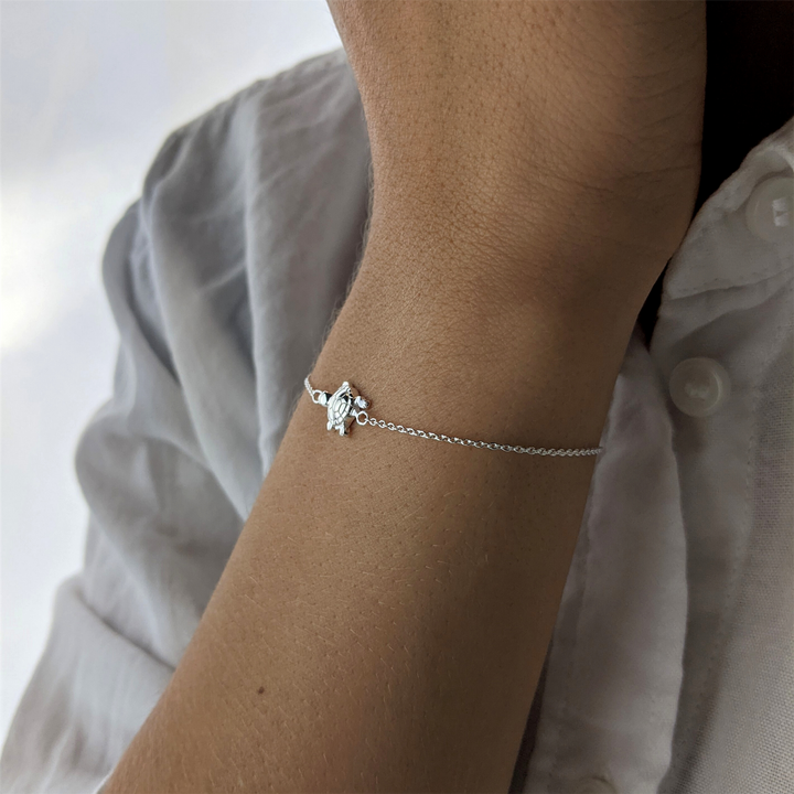 Sterling silver thin chain bracelet with turtle charm
