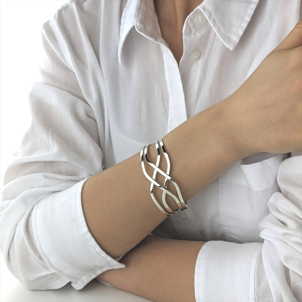 
                  
                    Sterling Silver Wide Crossover Celtic Knot Adjustable Cuff Bangle
                  
                