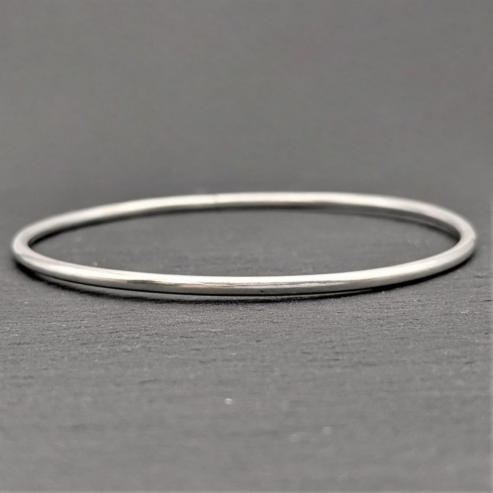 
                  
                    Karen Hill Tribe Silver Plain Thin Round Tube Stacking Bangle
                  
                