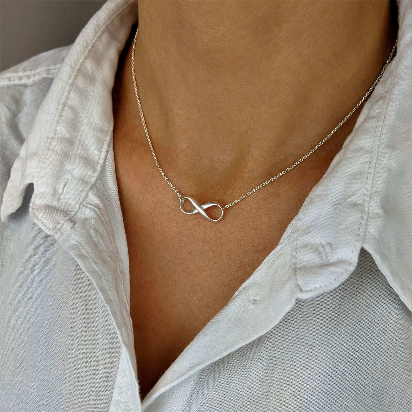 1/5 CT. T.W. Diamond Sideways Infinity Necklace in Sterling Silver with 18K  Gold Plate | Zales