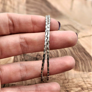 
                  
                    Hill Tribe Silver Thin Round Tube Tribal Motif Stackable Bangle
                  
                