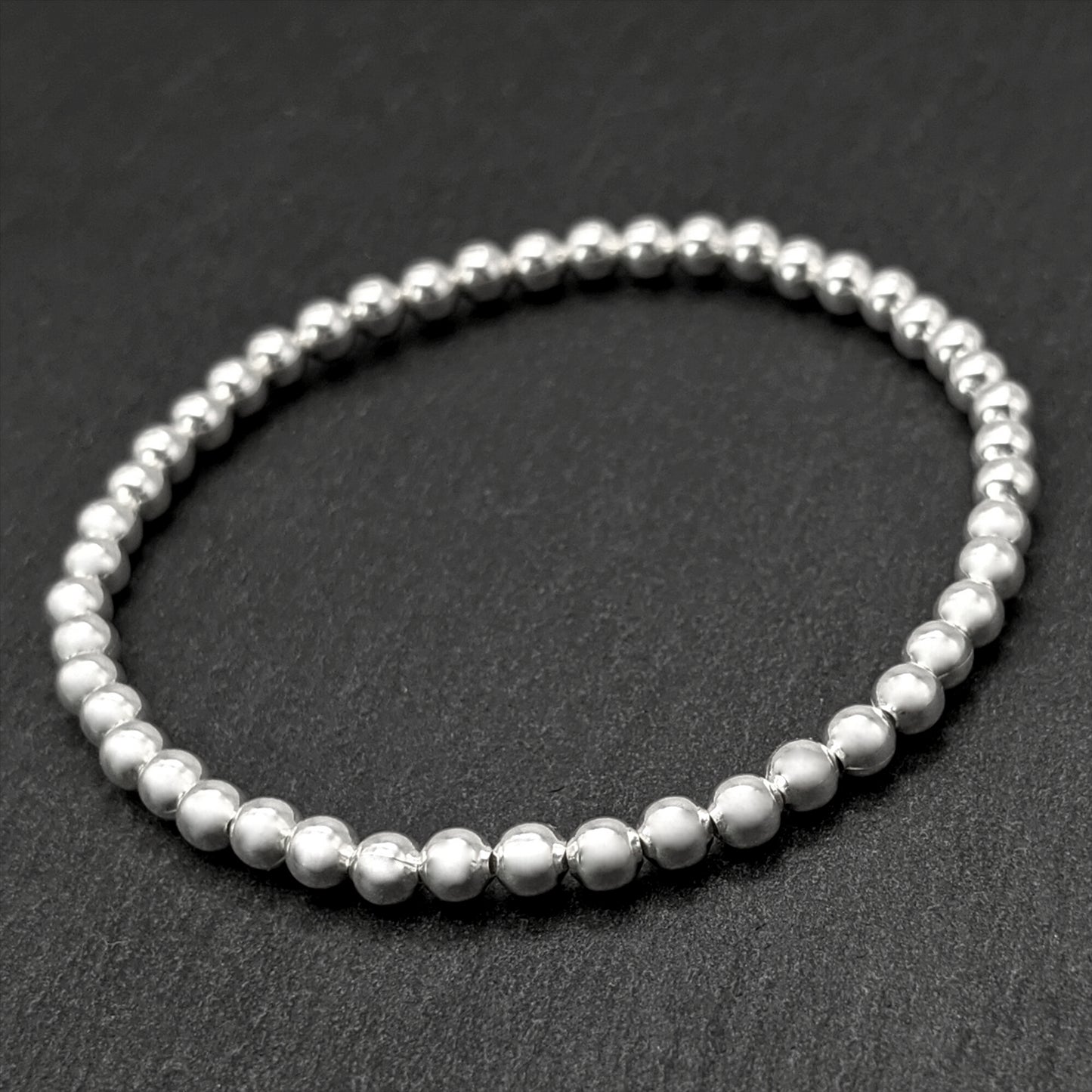 
                  
                    Sterling Silver Stackable Stretch Bead Bracelet With 4 mm Ball Beads
                  
                