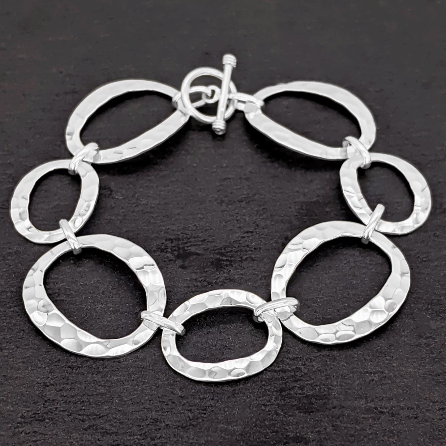 
                  
                    Sterling Silver Hammered Open Circles Oval Link Bracelet Toggle Clasp
                  
                