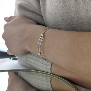 
                  
                    Sterling Silver Extra Small Round Wire Overlapping Adjustable Bangle
                  
                