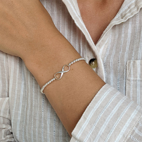 Sterling silver infinity stretch bracelet with 3mm ball beads and figure-of-eight charm