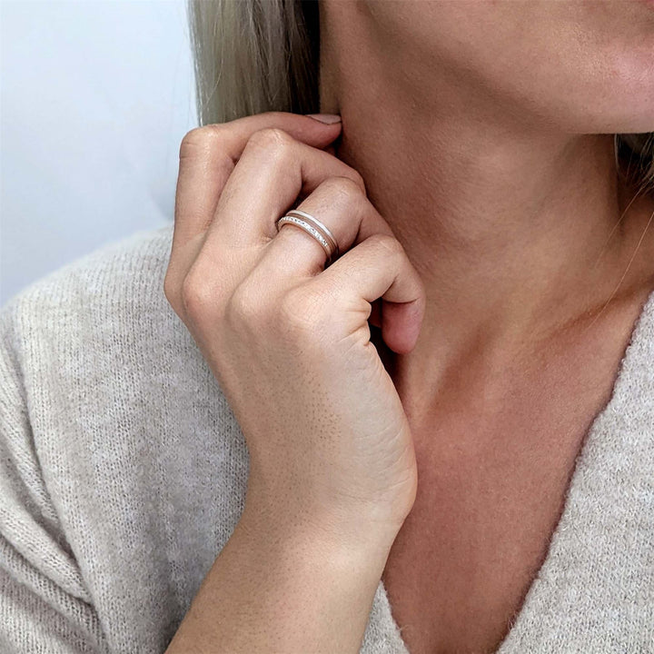 Side view of sterling silver double band ring — 15 cubic zirconia stones along the front band