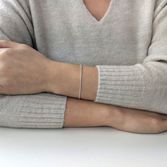 
                    
                      Sterling silver ball bead stretch bracelet worn on wrist
                    
                  